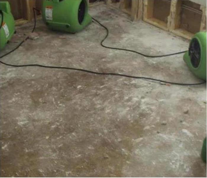 concrete floor, studs, and air movers green