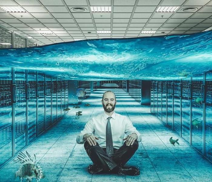 A man sitting under water in a room
